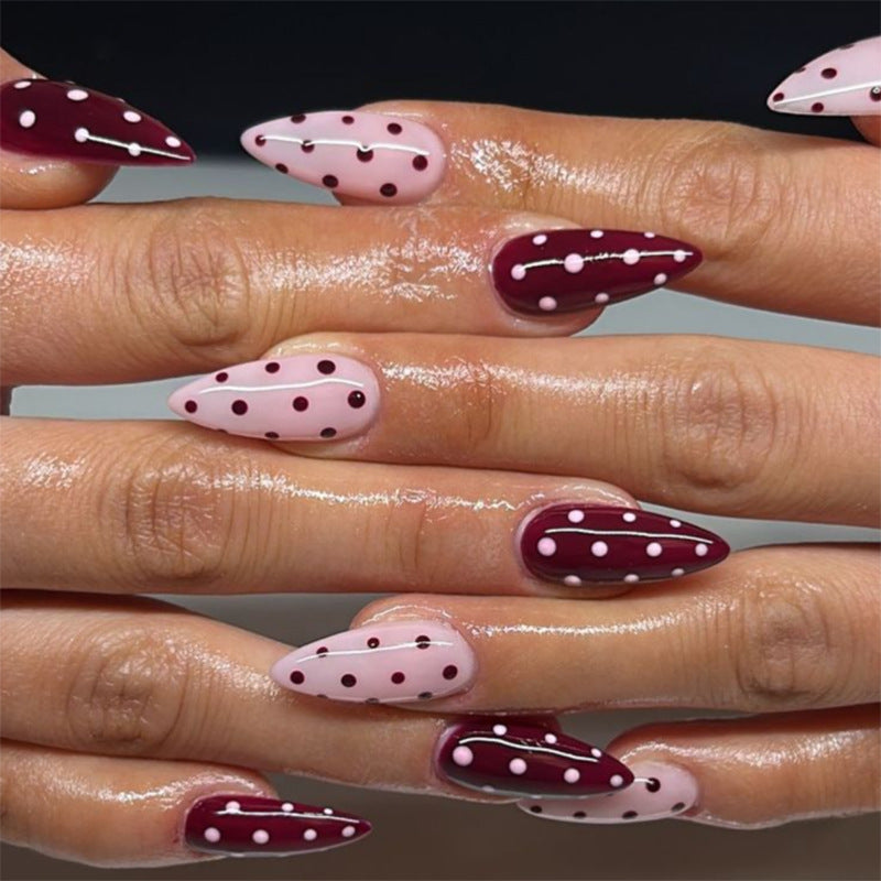 Artful Nail Extensions with Dots and Elegant Accents Bowlift