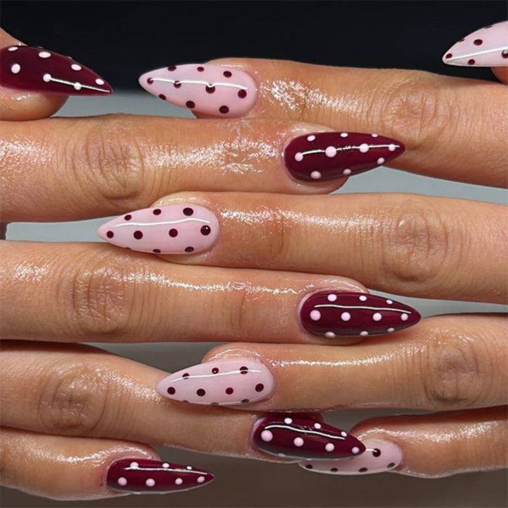 Artful Nail Extensions with Dots and Elegant Accents Bowlift