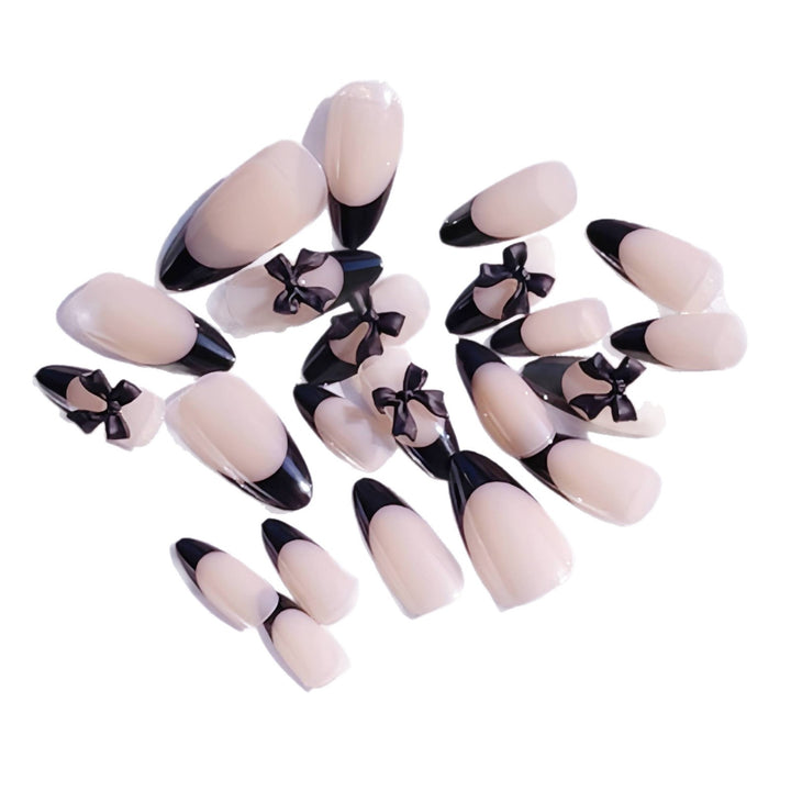 Artistic Stiletto Press-On Nail Design with Bow Accents Bowlift