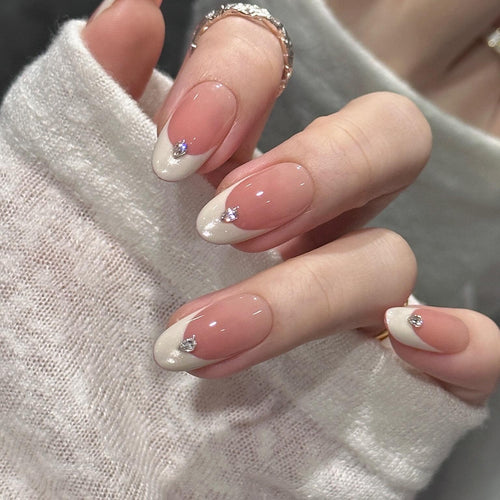Artificial nails with elegant French style and sparkling accents Bowlift