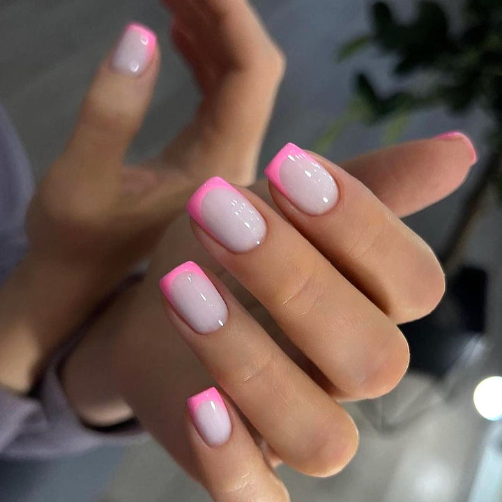 Artful nail design with elegant French tip and modern accents Bowlift