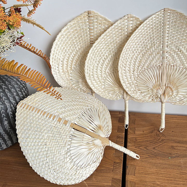 Women hand-woven fan made of natural material Bowlift