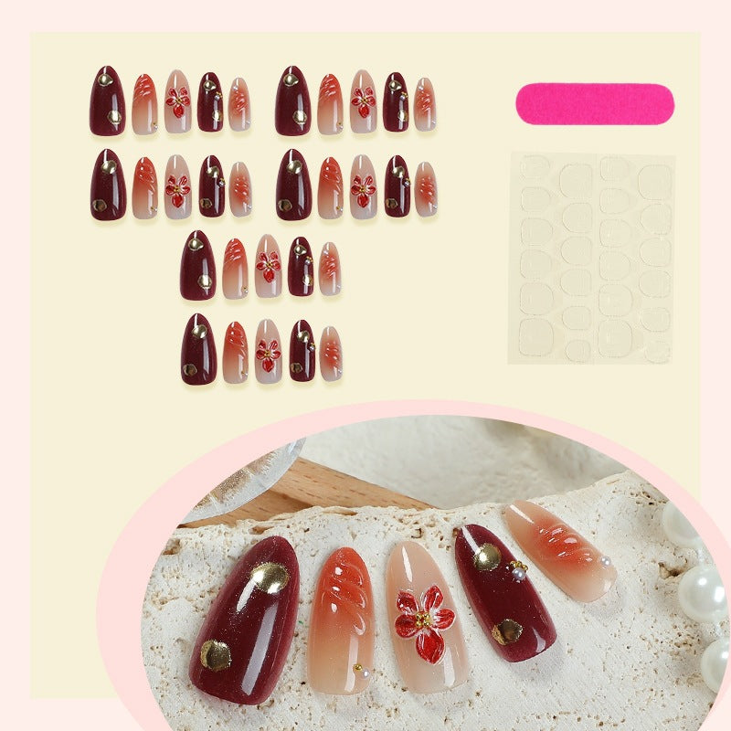 Acrylic nail set with elegant floral accents and glitter details Bowlift