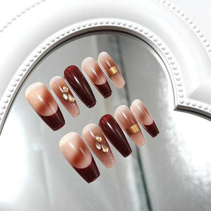 Luxurious artificial nails with glamorous decorations Bowlift