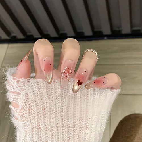 Artistic Press-On Nail Set with Heart and Design Accents Bowlift