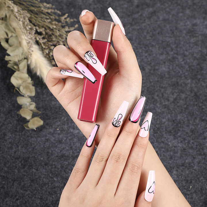 Eye-catching artificial nails with soulful heart design and glamorous accents Bowlift