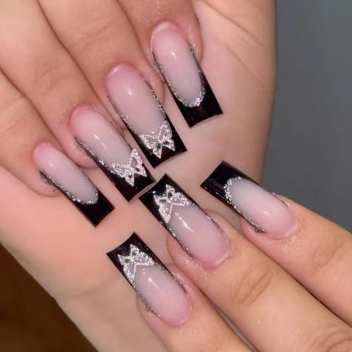 Glamorous Stiletto Nail Extensions with Butterfly Accents Bowlift