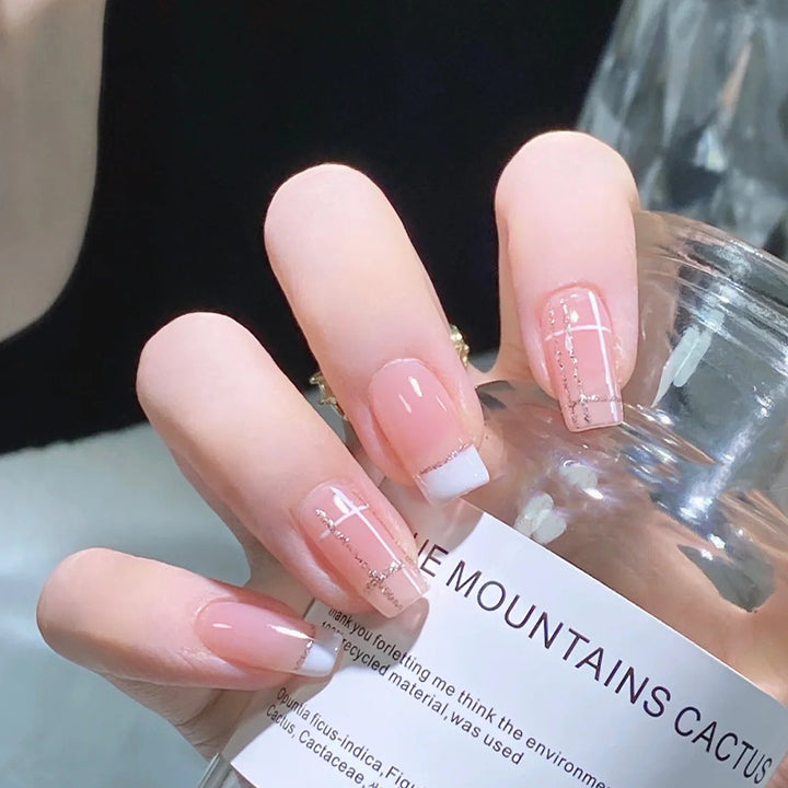 Nail set with elegant French tip and fashionable embellishments Bowlift