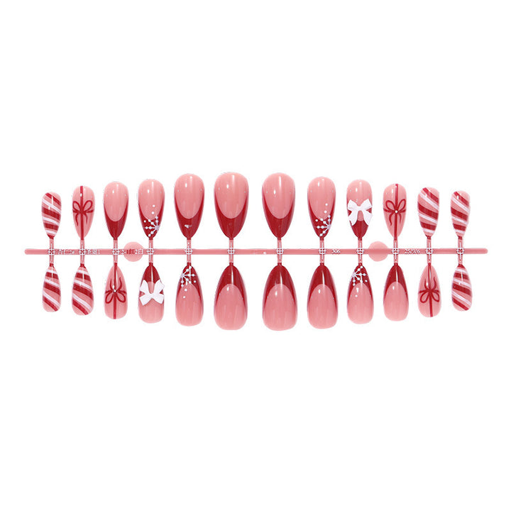 Artificial nail set with festive bow and stripe designs Bowlift