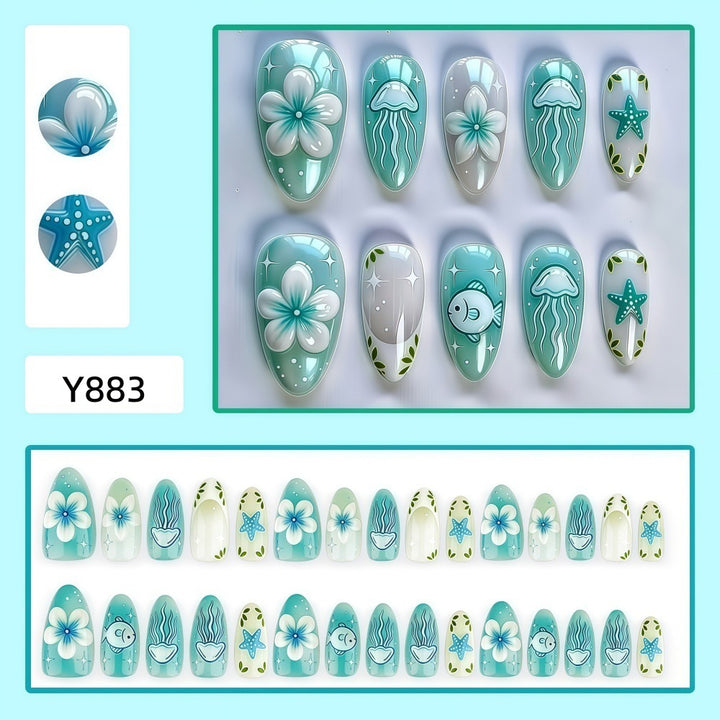 Artificial nails in a maritime design with colorful shell and water motifs Bowlift