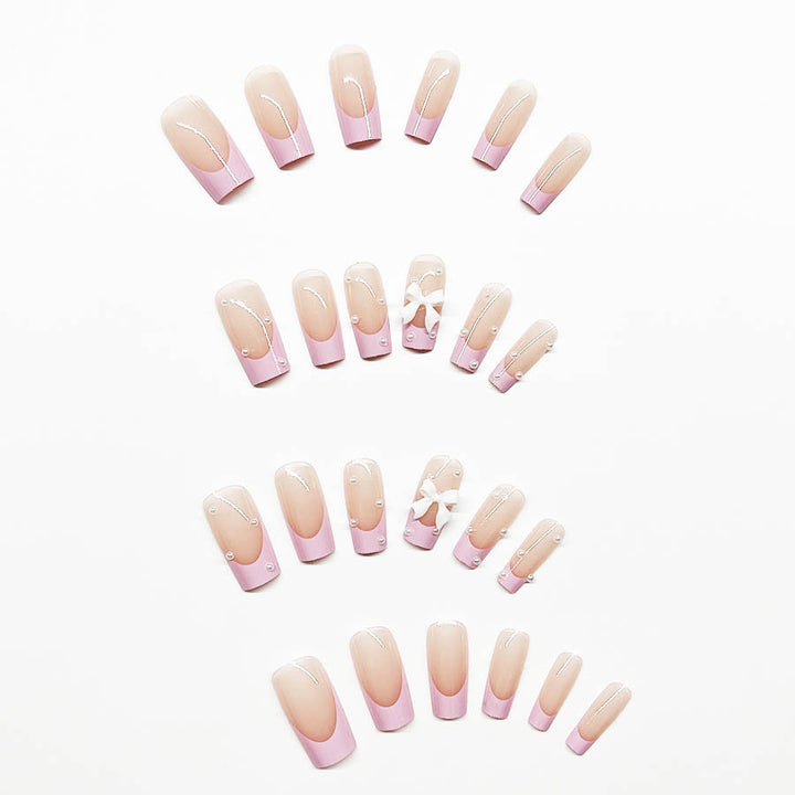 Artificial nail set with romantic bow and pearl embellishments Bowlift