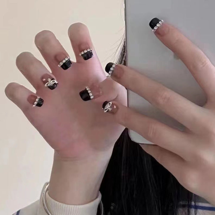 Glamorous nail art with rhinestone embellishments Bowlift
