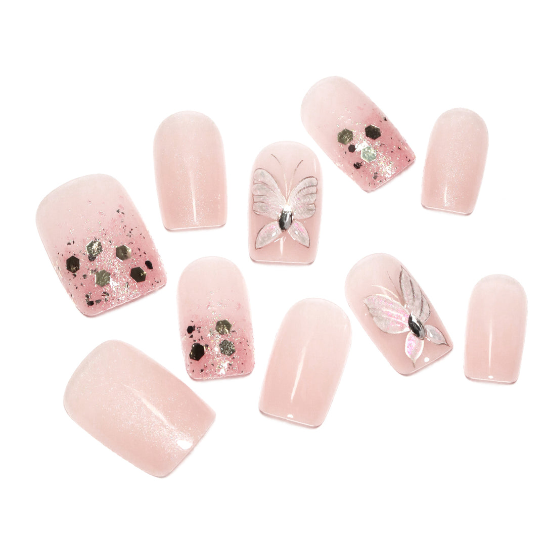 Artful nail art with butterfly designs and glitter accents Bowlift