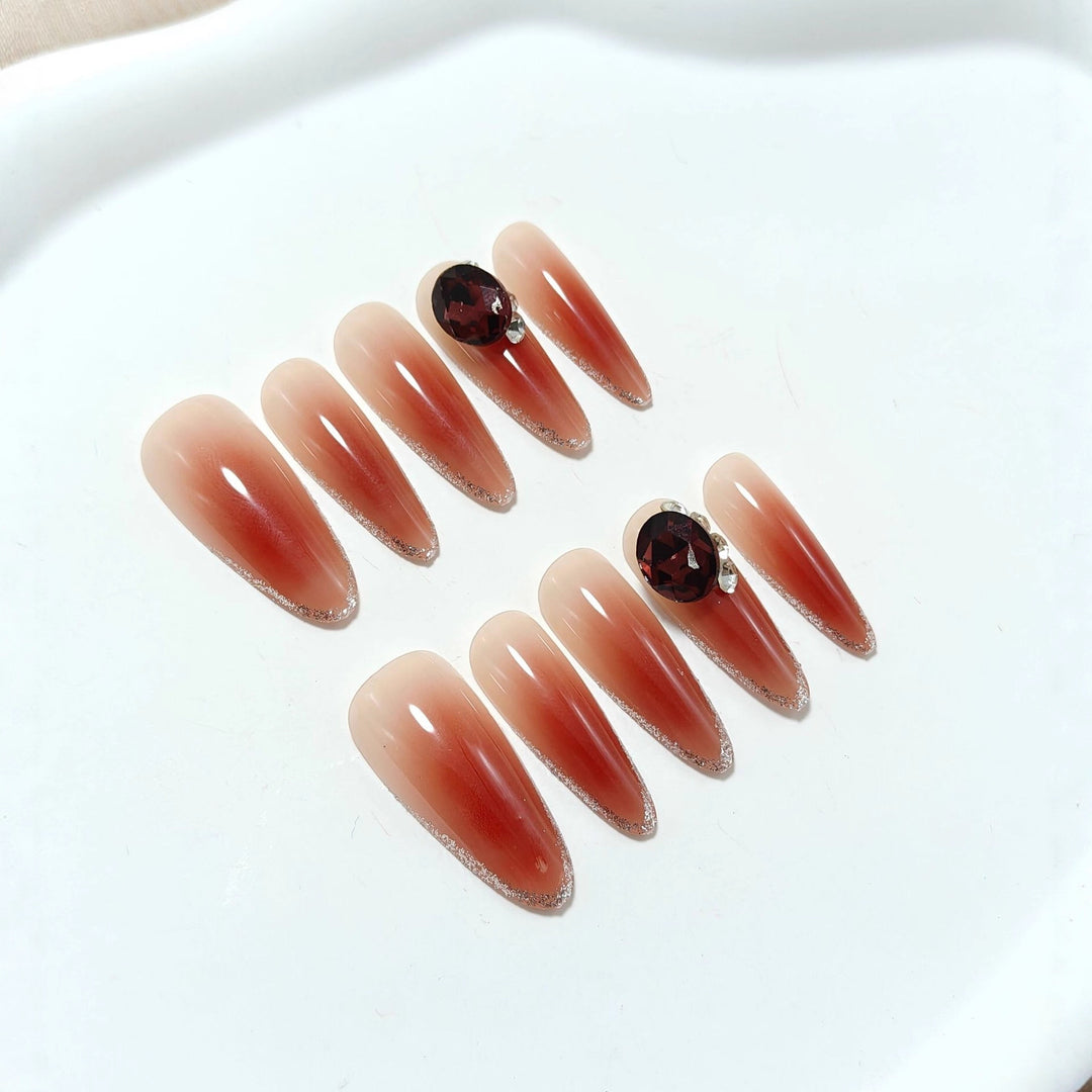 Elegant artificial nails with rhinestone applications Bowlift