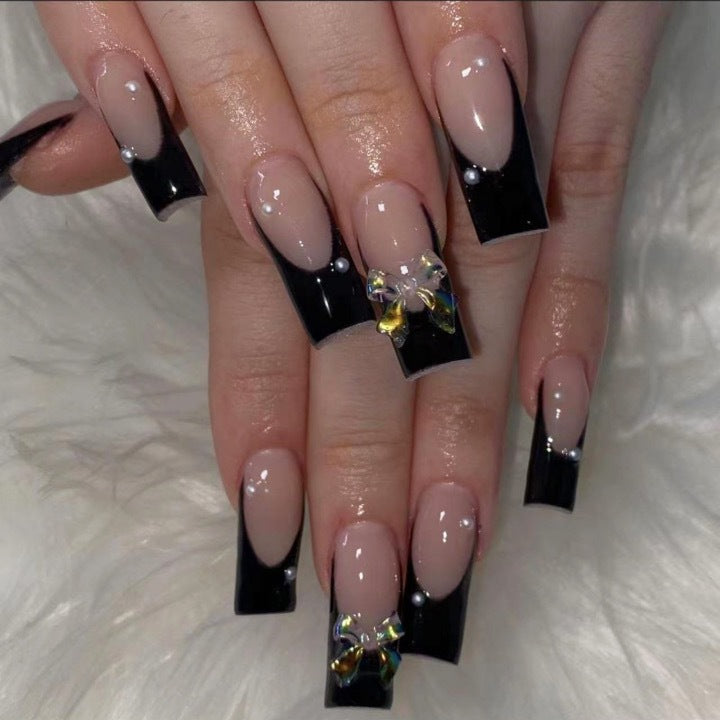 Nail decoration with elegant bows and rhinestones Bowlift