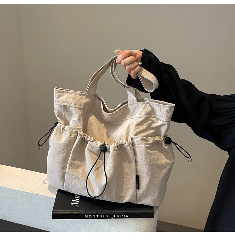 Practical everyday handbag with drawstring Bowlift