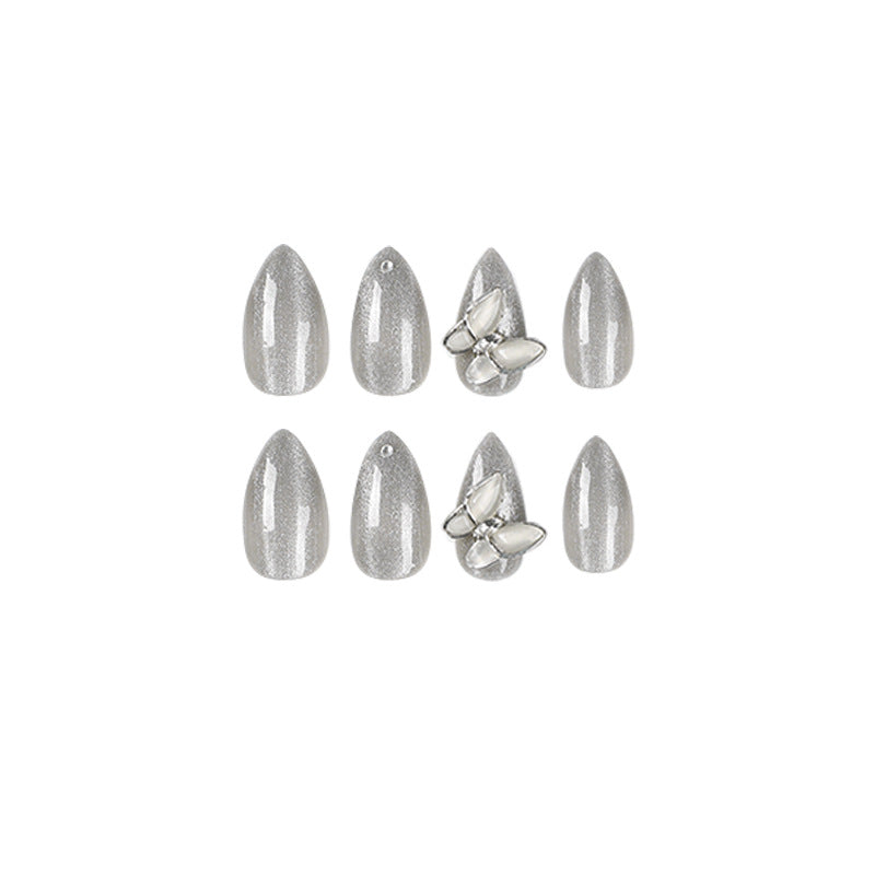 Glamorous stiletto nails with radiant glitter and elegant 3D design Bowlift