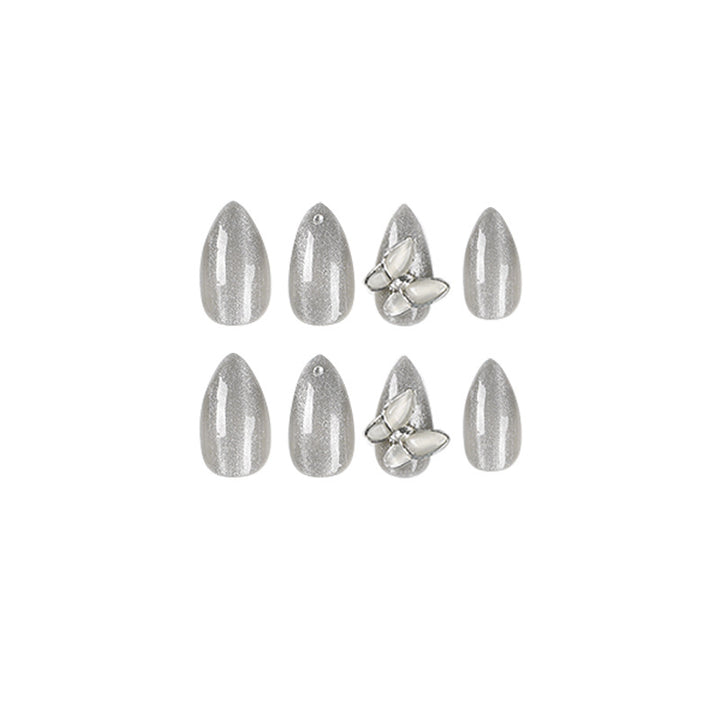 Glamorous stiletto nails with radiant glitter and elegant 3D design Bowlift