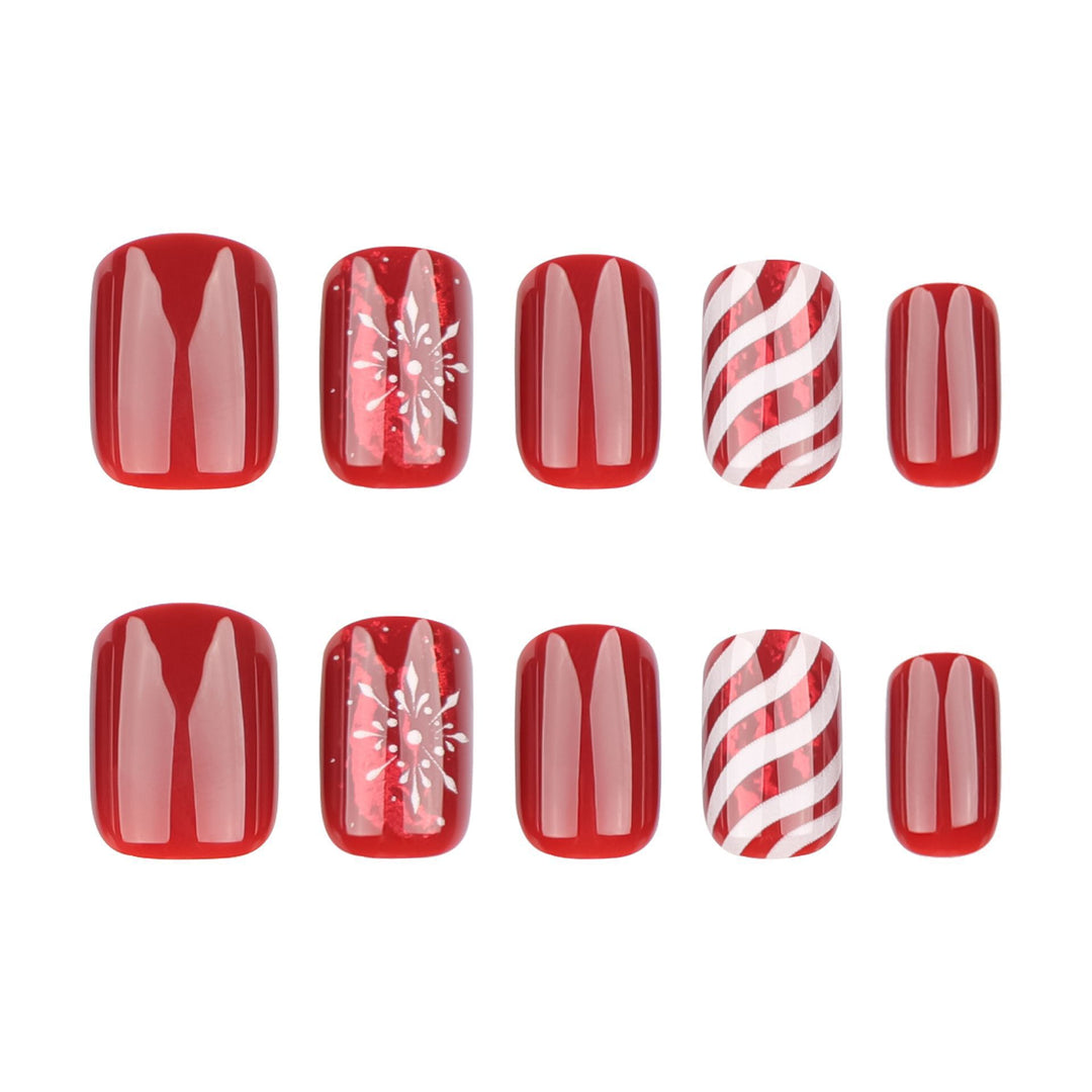 Artificial nail set with festive designs and glitter accents Bowlift