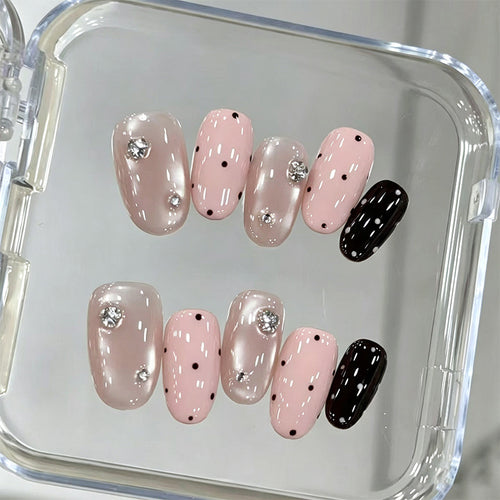 Acrylic nail set with glamorous rhinestone accents and modern dots Bowlift