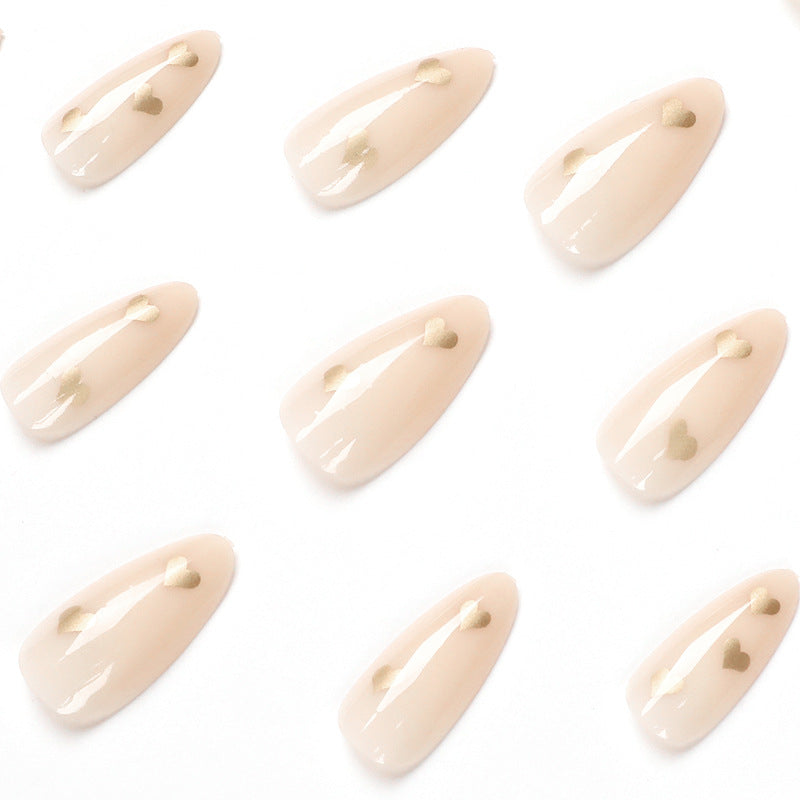 Artful Nail Art with Golden Heart Accents Bowlift