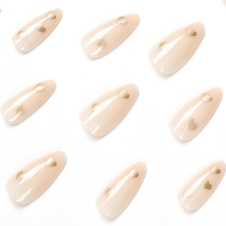 Artful Nail Art with Golden Heart Accents Bowlift
