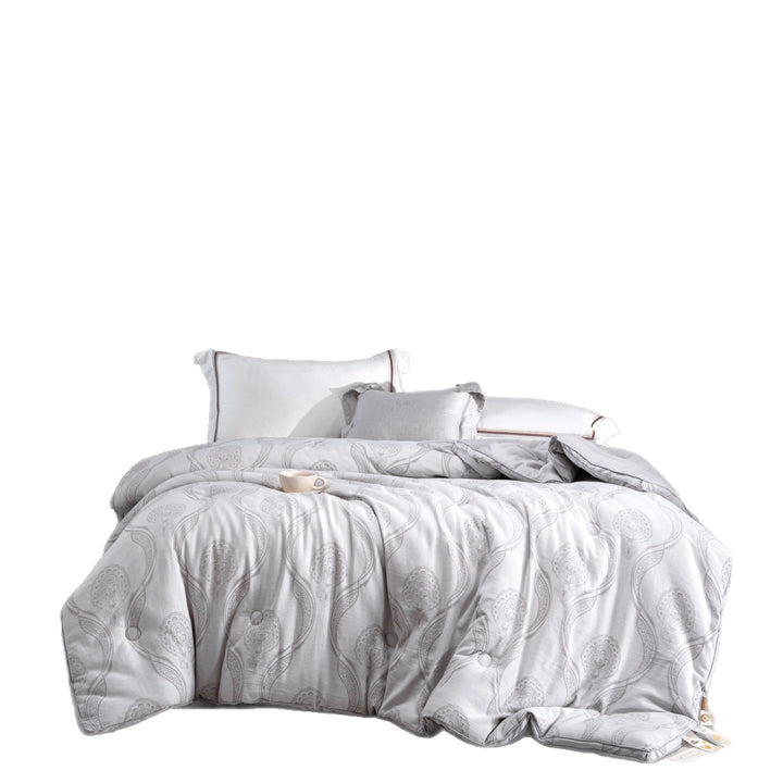 Quilted comfort duvet with jacquard pattern, button quilting, and soft microfiber cover