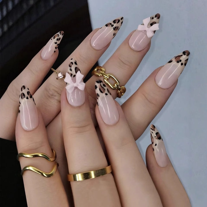 Acrylic nail set with leopard pattern and decorative bows Bowlift