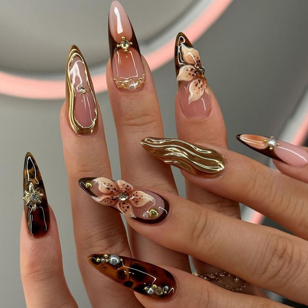 Artistic Stiletto Press-On Nail Art with Floral and Gemstone Accents Bowlift