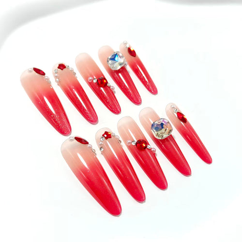 Artificial nails in elegant ombre style with glitter and jewelry accents Bowlift