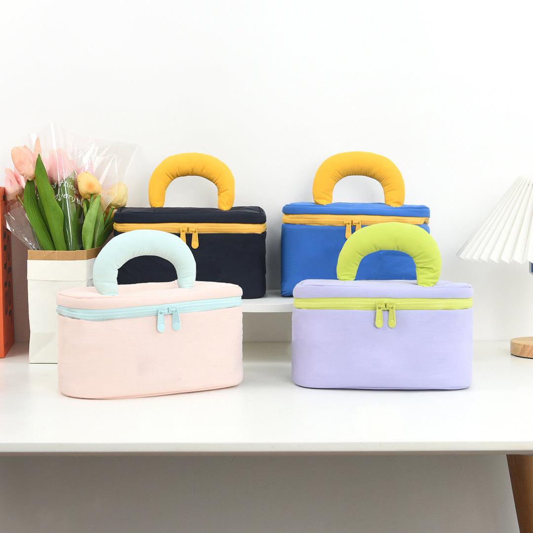 Cosmetic organizer with ergonomic carrying handle Bowlift