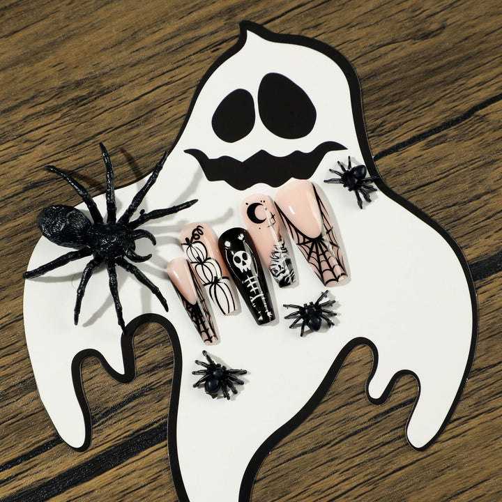 Artificial nail art in Halloween style with graffiti designs Bowlift