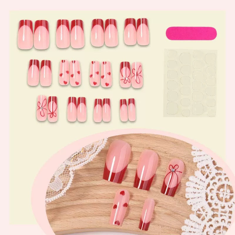 Artificial nail set with romantic heart and bow motifs Bowlift