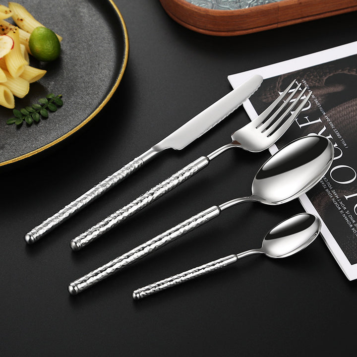 Elegant dessert spoon with elaborate handle design Bowlift
