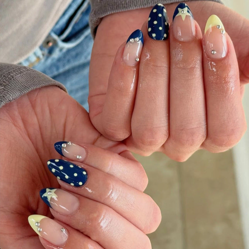 Artistic Nail Design with Star and Polka Dot Accents Bowlift