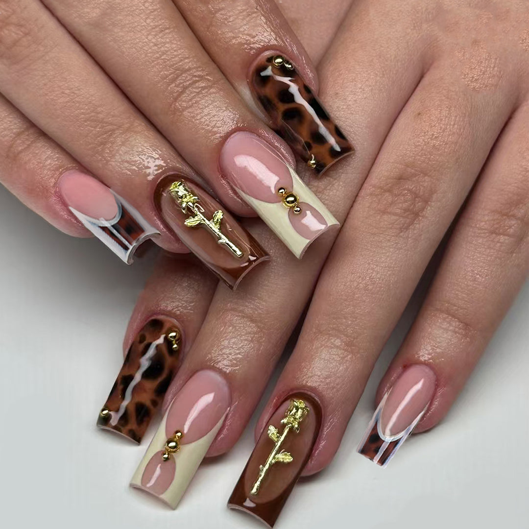 Artificial nails with luxurious embellishments and animalistic design Bowlift