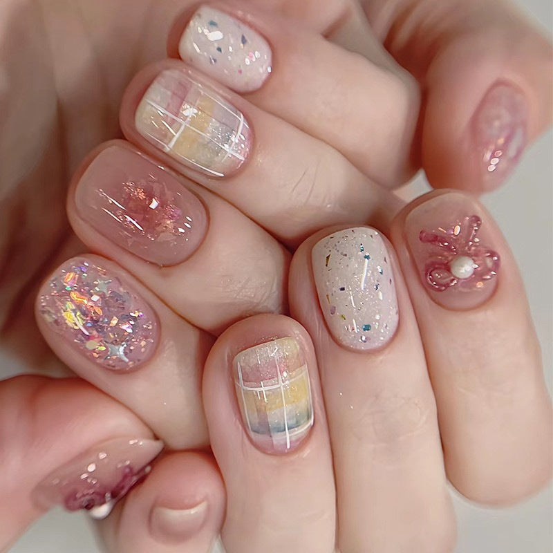 Creative nail art set with glitter and floral applications Bowlift