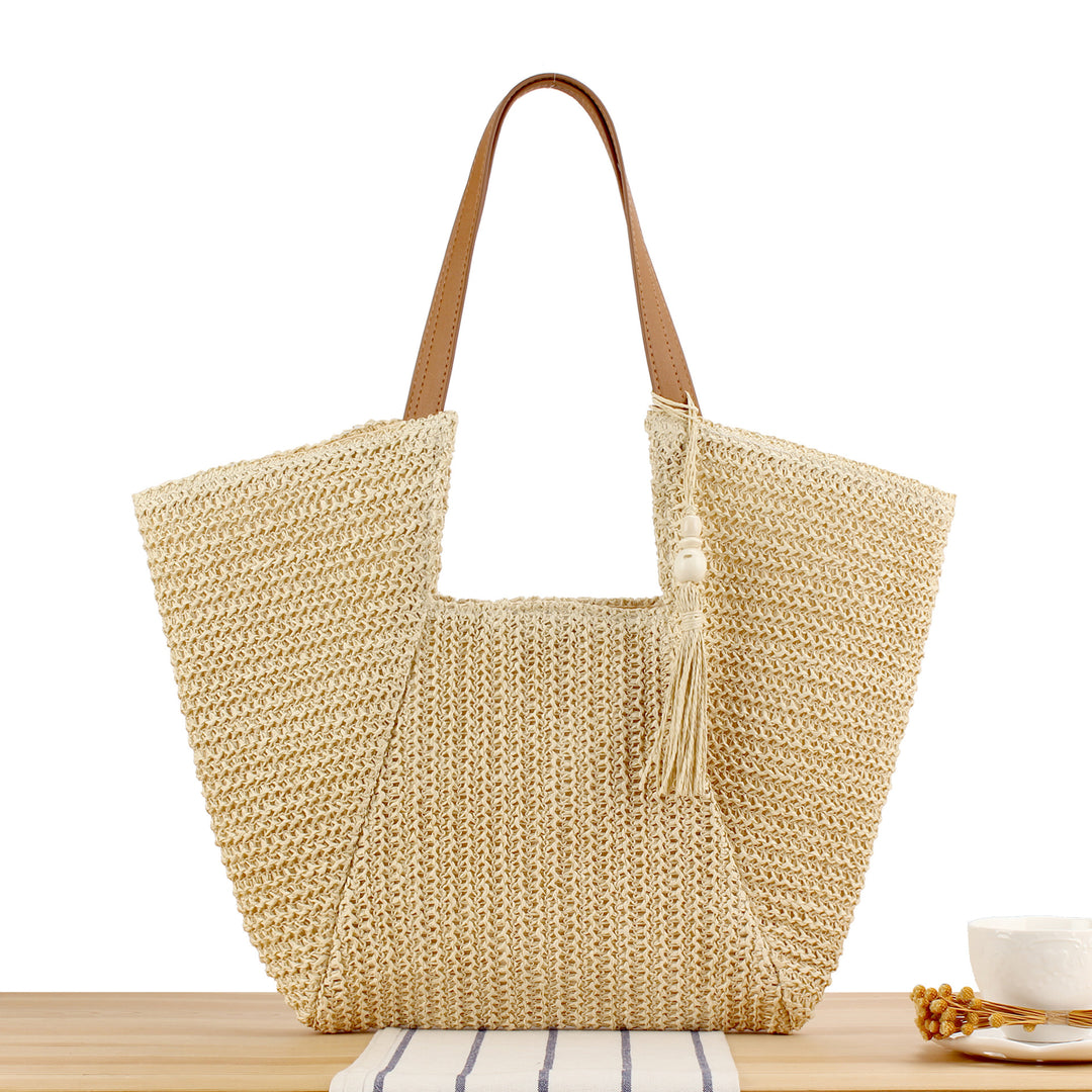 Beach bag made of natural weave with elegant leather accents Bowlift