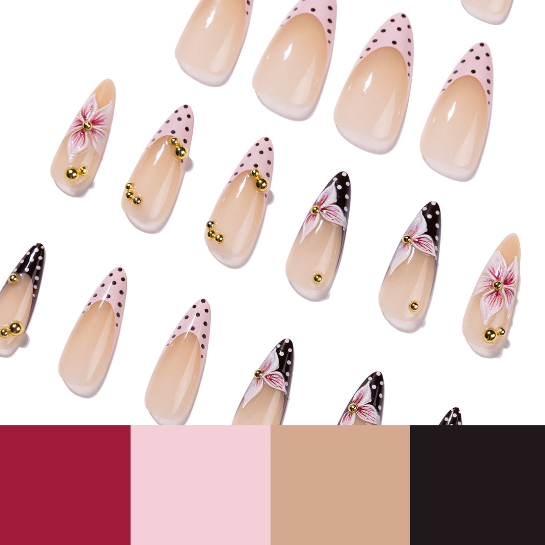 Artful stiletto nails with floral accents and glitter Bowlift
