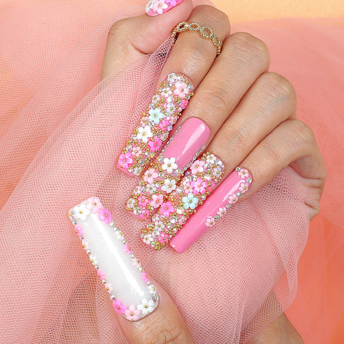 Artificial nail set with floral decorations and glitter accents Bowlift