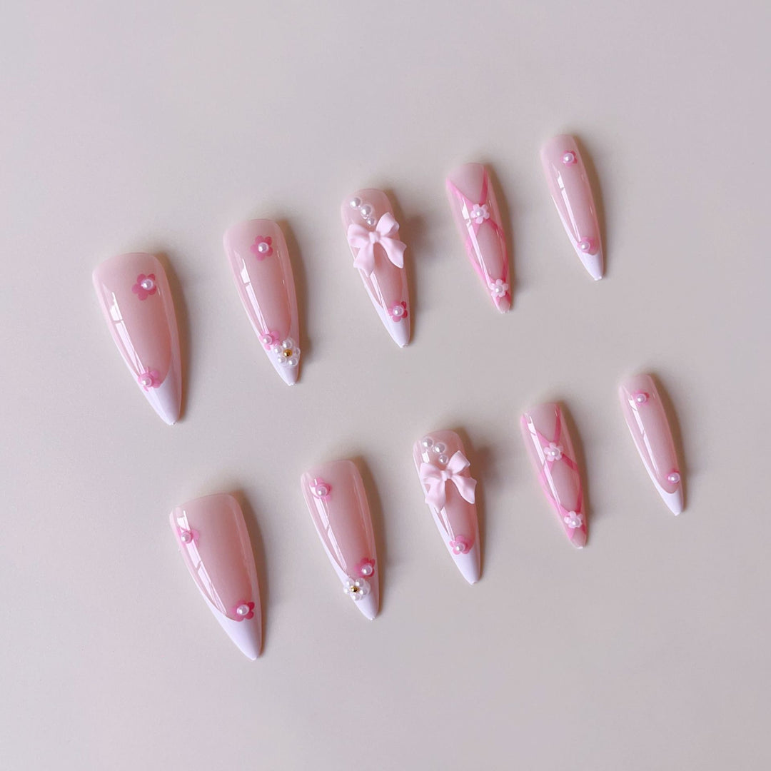 False nail set with playful 3D details and elegant accents Bowlift