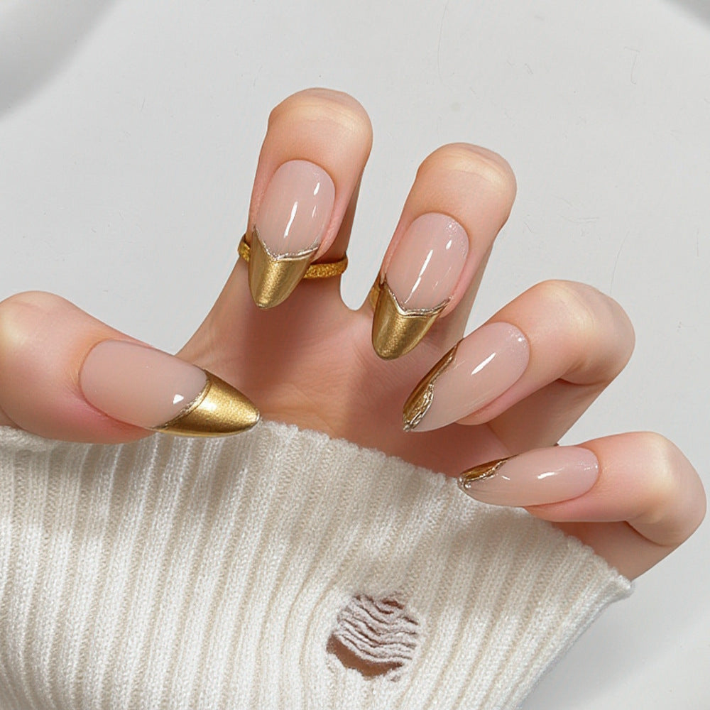 Artificial nails in elegant stiletto design with gold accents Bowlift