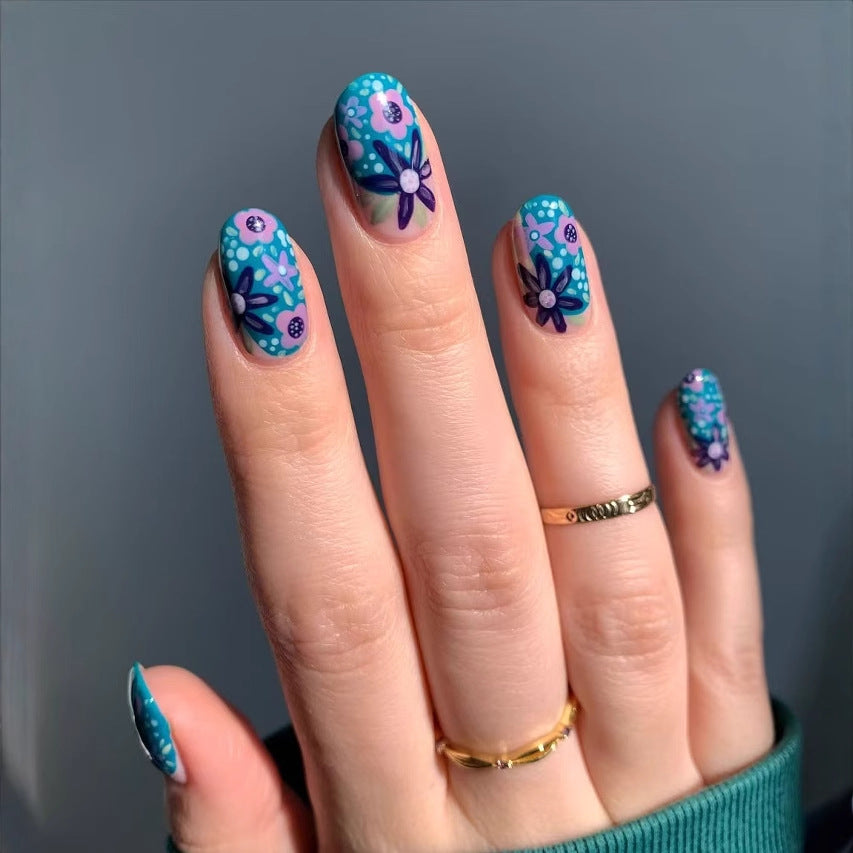 Nail art set with floral accents and vibrant patterns Bowlift