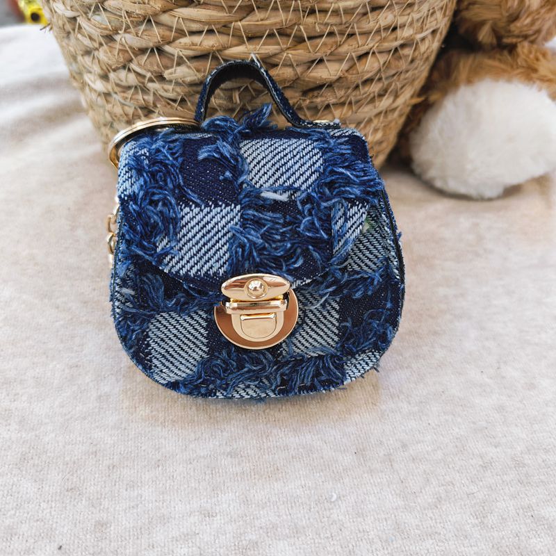 Distressed denim micro crossbody mini purse with gold turn-lock top handle Bowlift