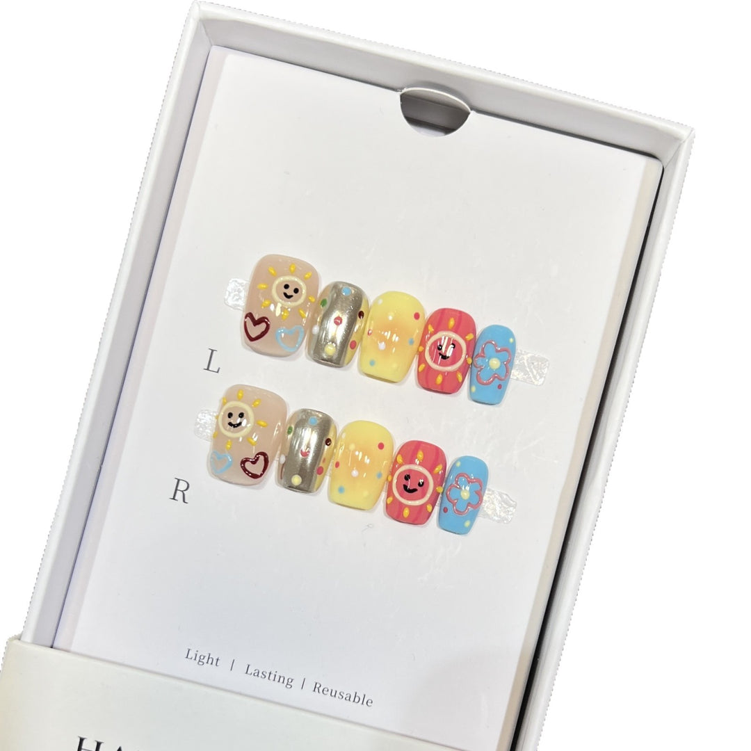 Whimsical Press-On Nail Art Set with Smiley Faces and Floral Designs Bowlift