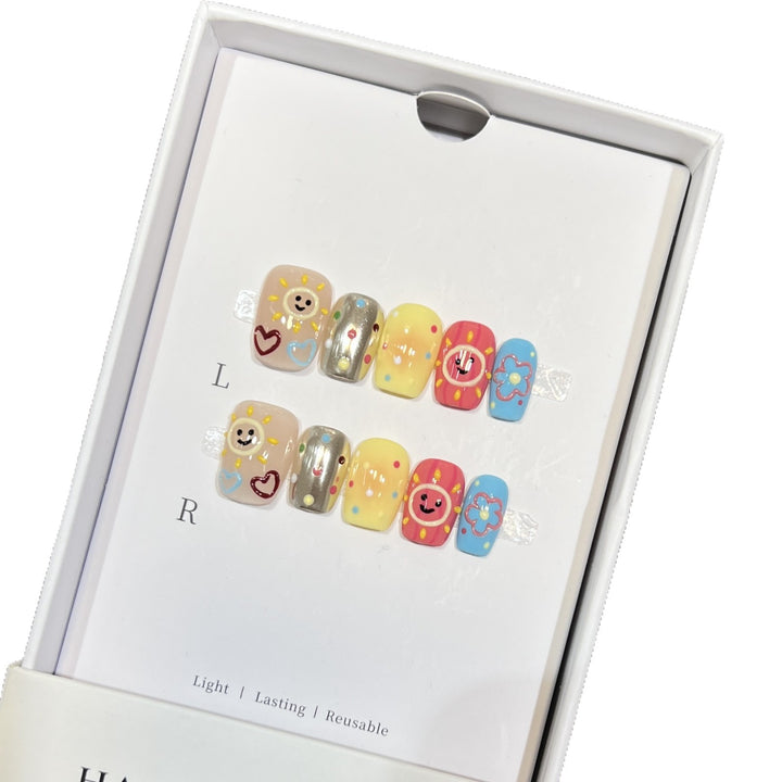 Whimsical Press-On Nail Art Set with Smiley Faces and Floral Designs Bowlift