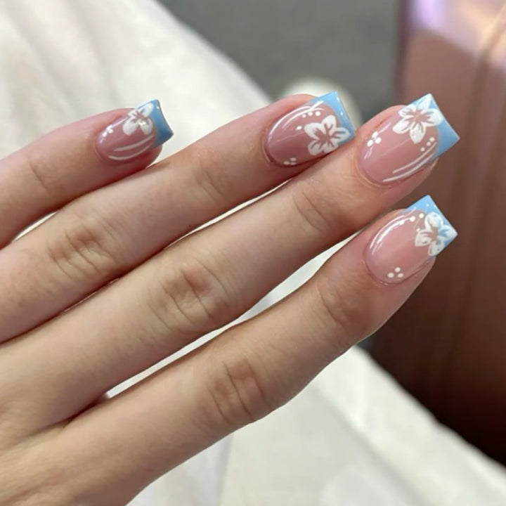 Artful Nail Art with Flower Design and Blue French Tip Bowlift