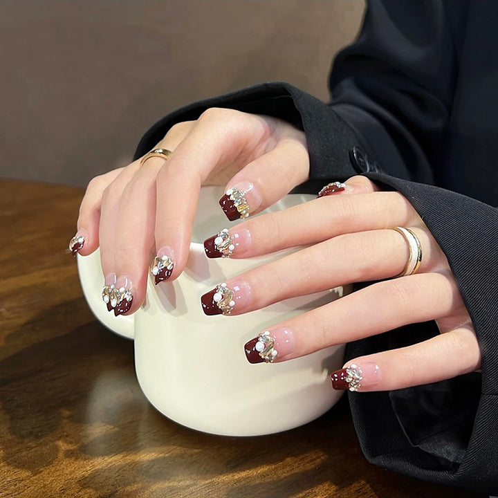 Acrylic nail set with elegant glitter and flower accents Bowlift