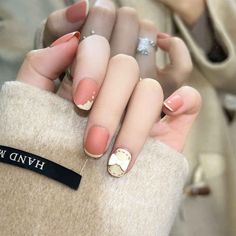 Artistic nail nails with decorative bow designs and French tips Bowlift