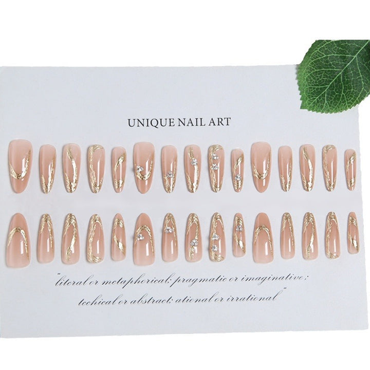 Artificial nail set with elegant gold design and sparkling applications Bowlift